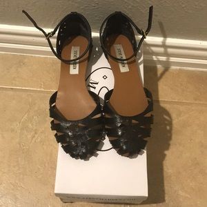 Black Steve Madden flat sandal.